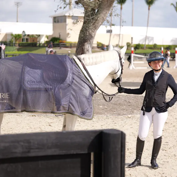 Rider with her grey horse in an L'Écurie cooler