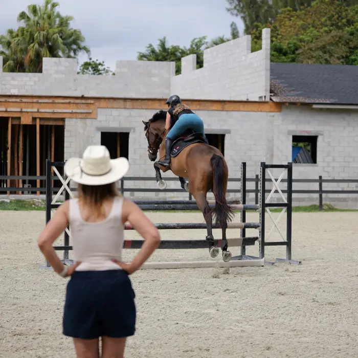 Jumping lesson under the trainer's eye