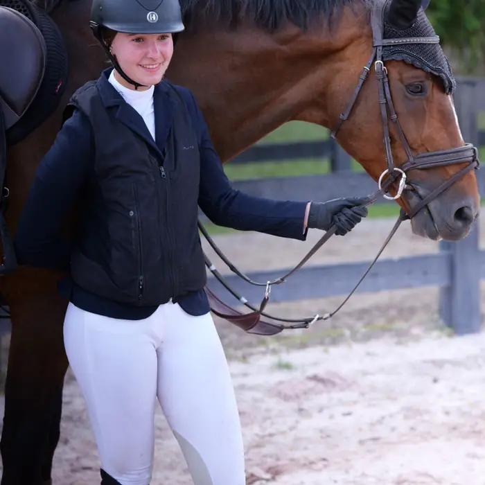 Rider with her horse after a round